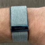 Person using the Whoop Step Counter app to track fitness progress